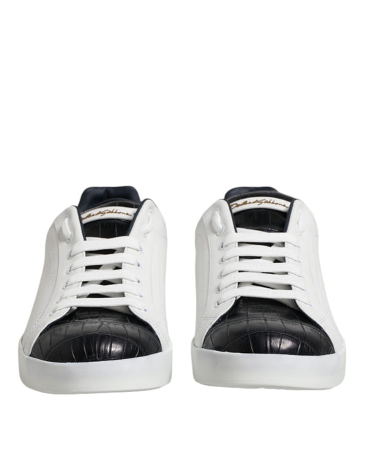 Pair of white black leather sneakers with gold accents, featuring a crocodile skin texture on the toe and heel