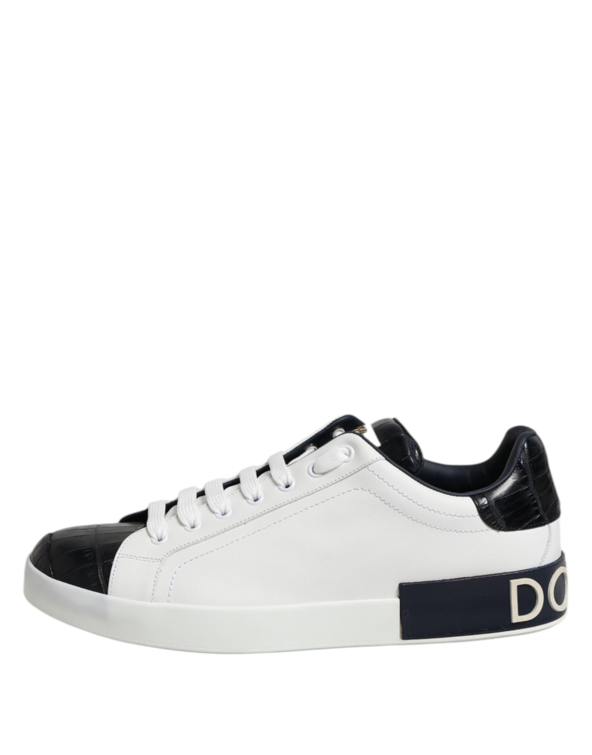 A pair of white black leather sneakers with a black and white checkered pattern on the side