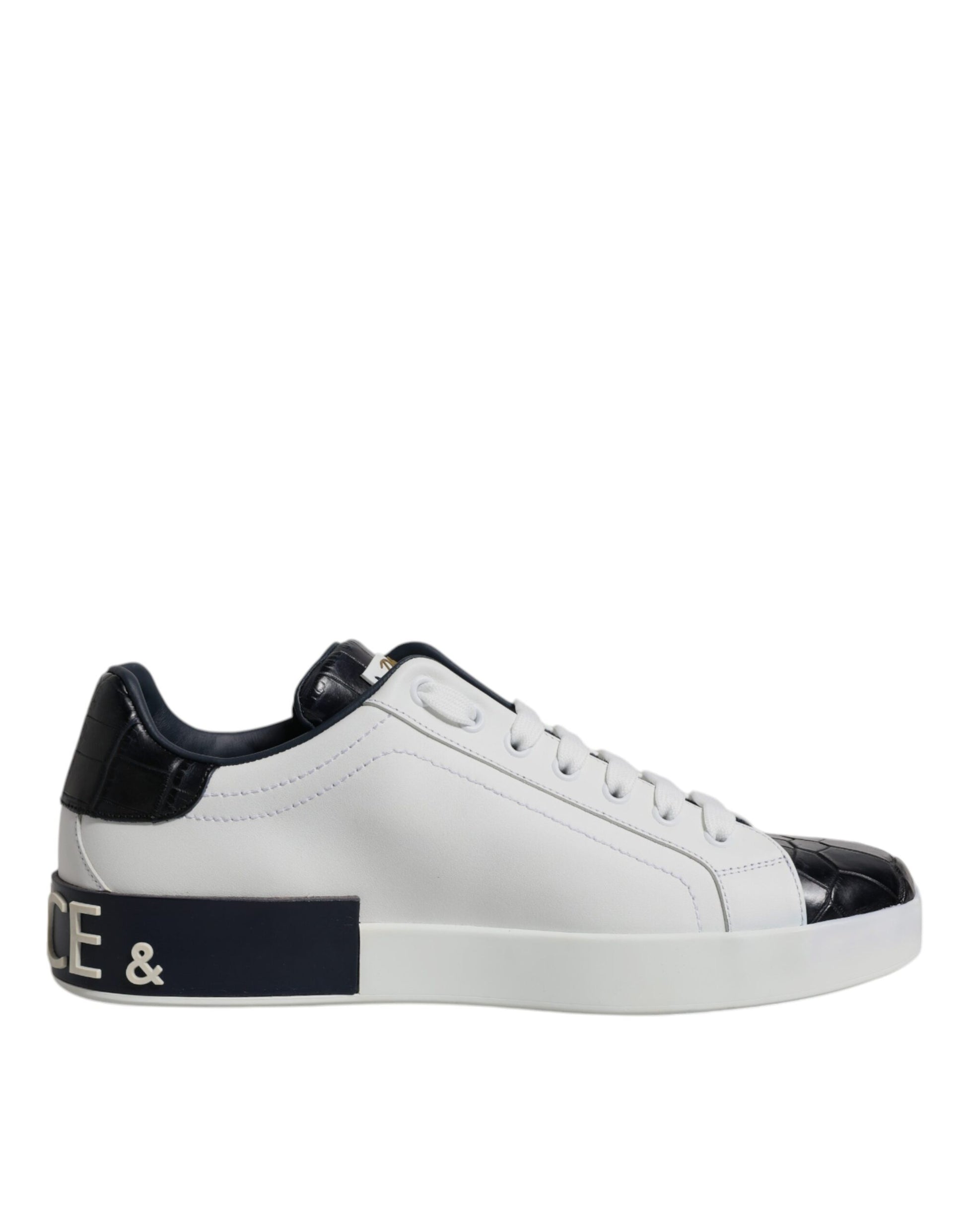 A pair of white black leather sneakers with a logo on the side, featuring a lace-up design and a flat sole