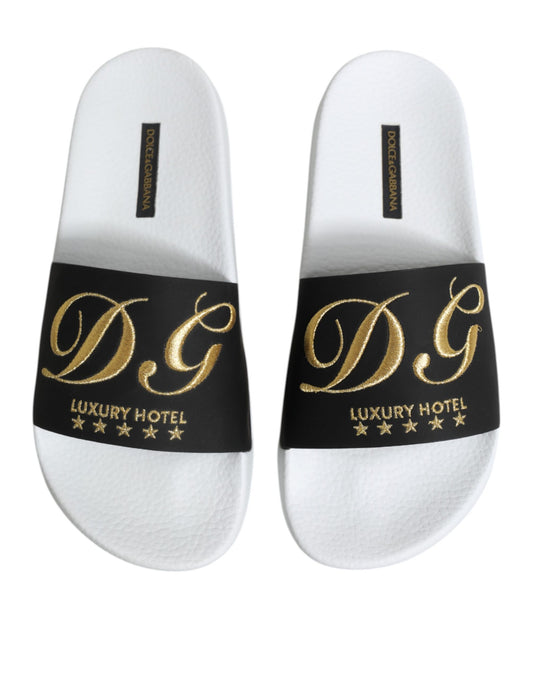 Pair of white slippers with black lettering and stars