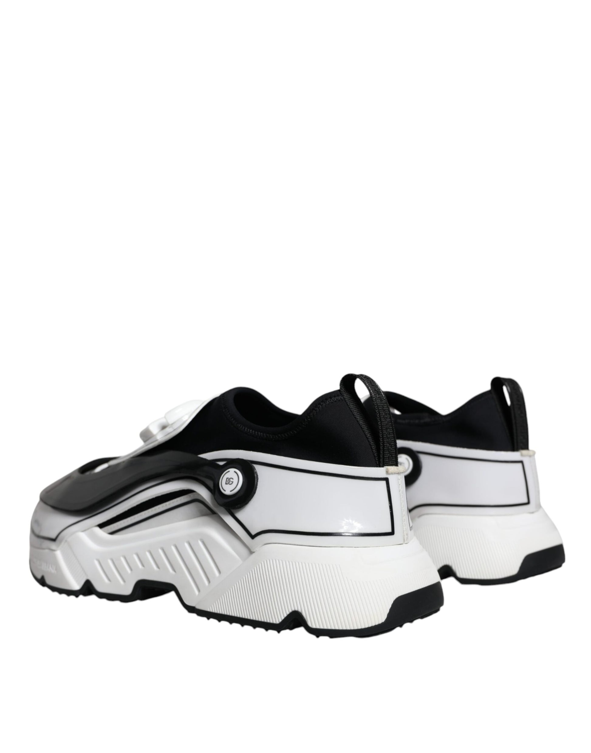 Pair of black and white sneakers with laces and a pull tab on the back
