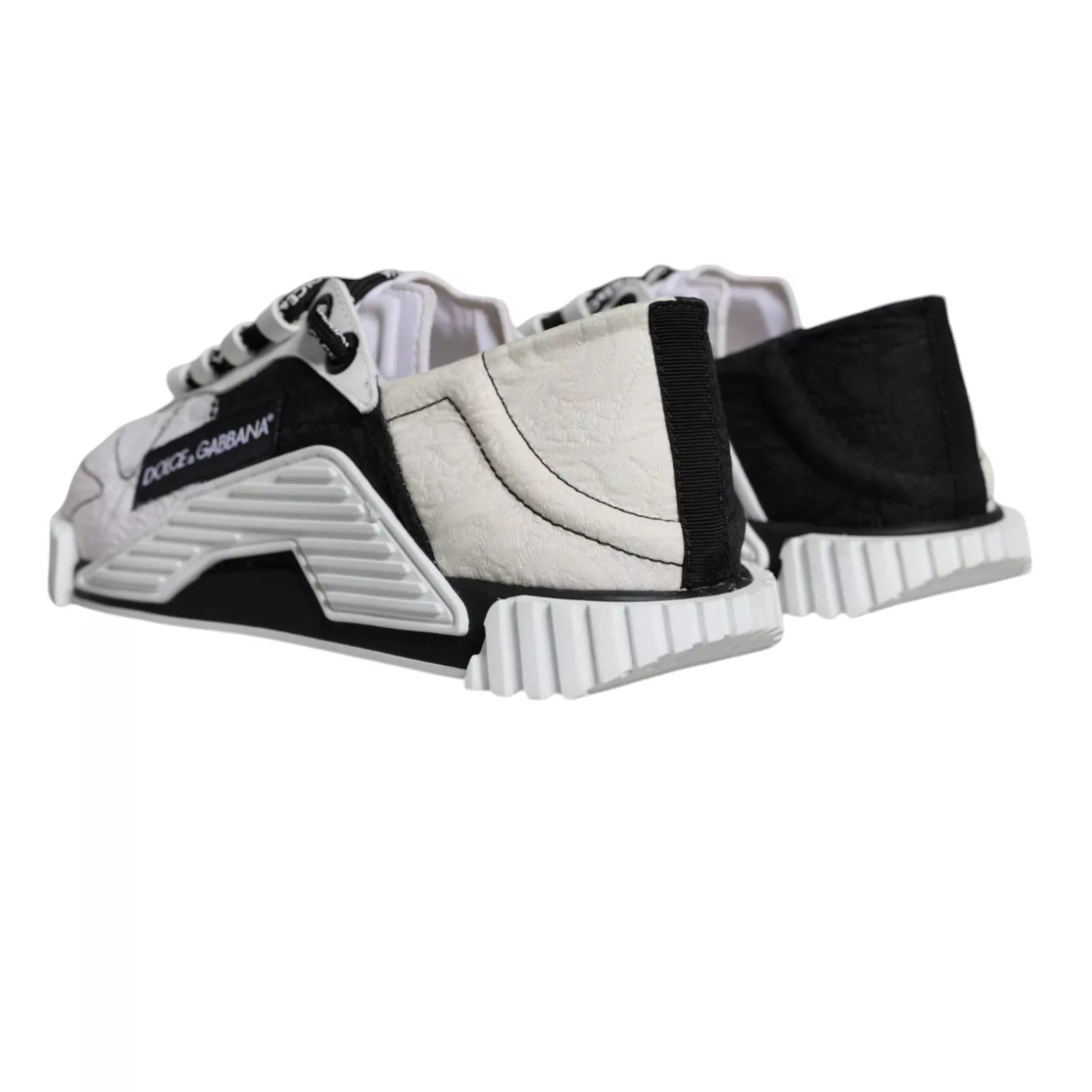 Pair of children's sneakers with white laces and a black sole