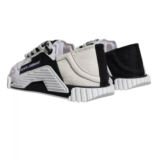 Pair of children's sneakers with white laces and a black sole