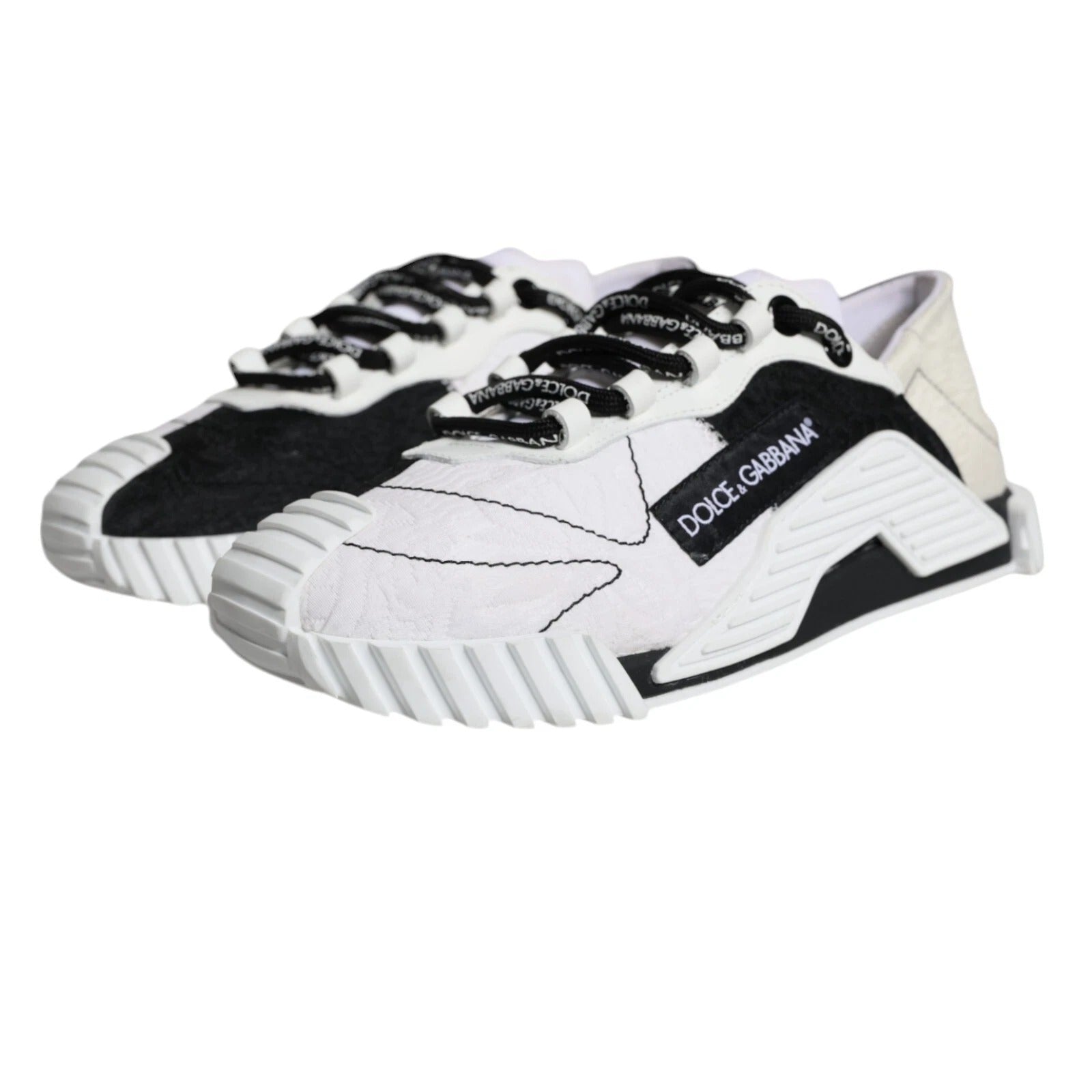 Pair of white sneakers with black accents