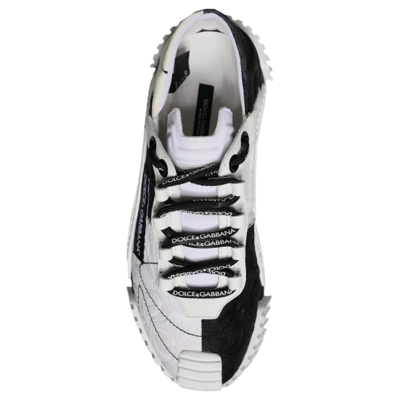 White sneaker with black laces and white sole