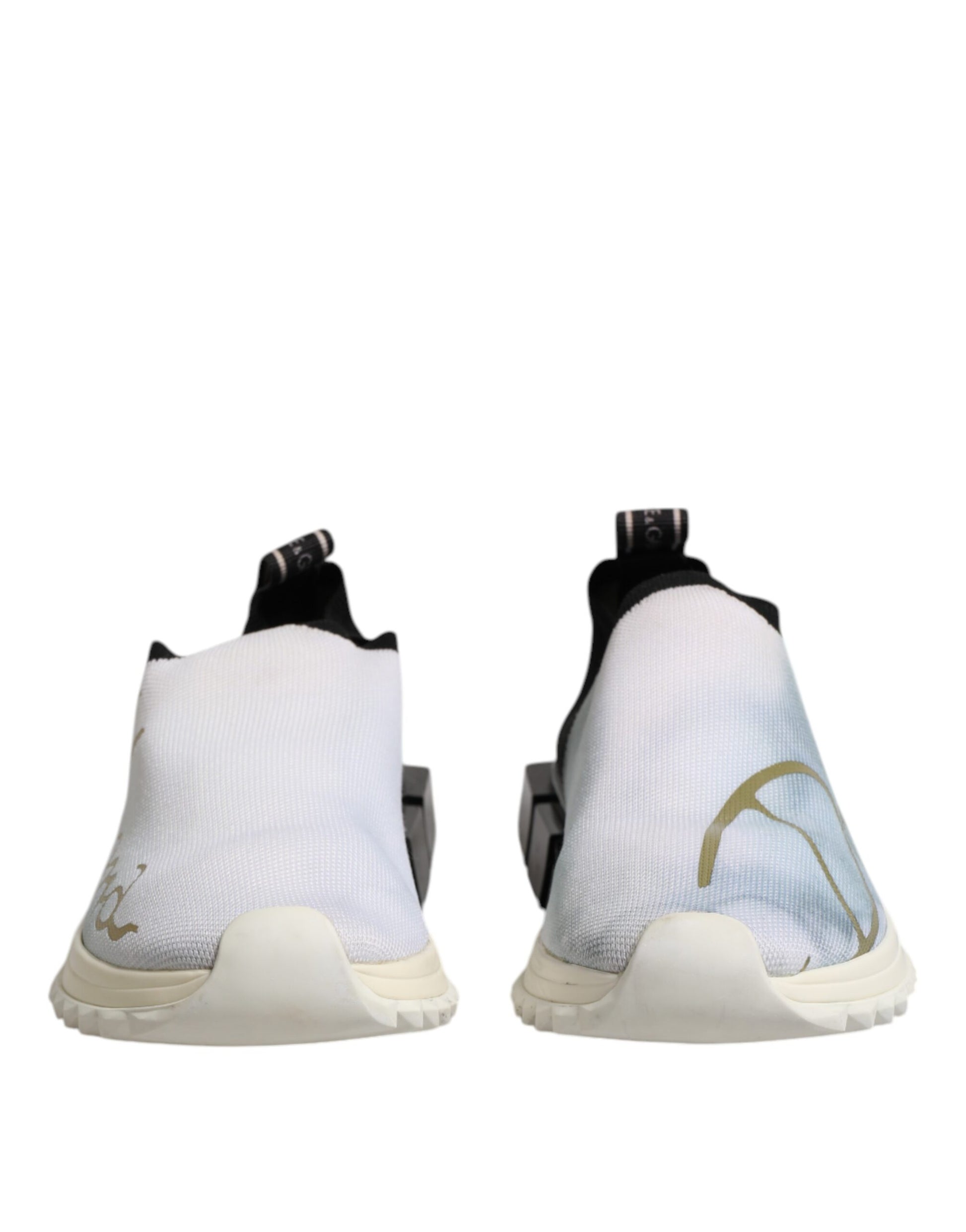 Pair of white black low top sneakers with gold design on side