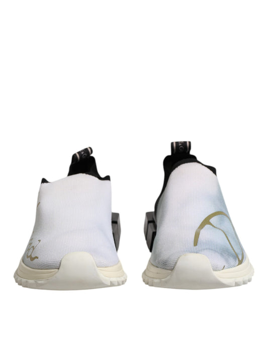 Pair of white black low top sneakers with gold design on side
