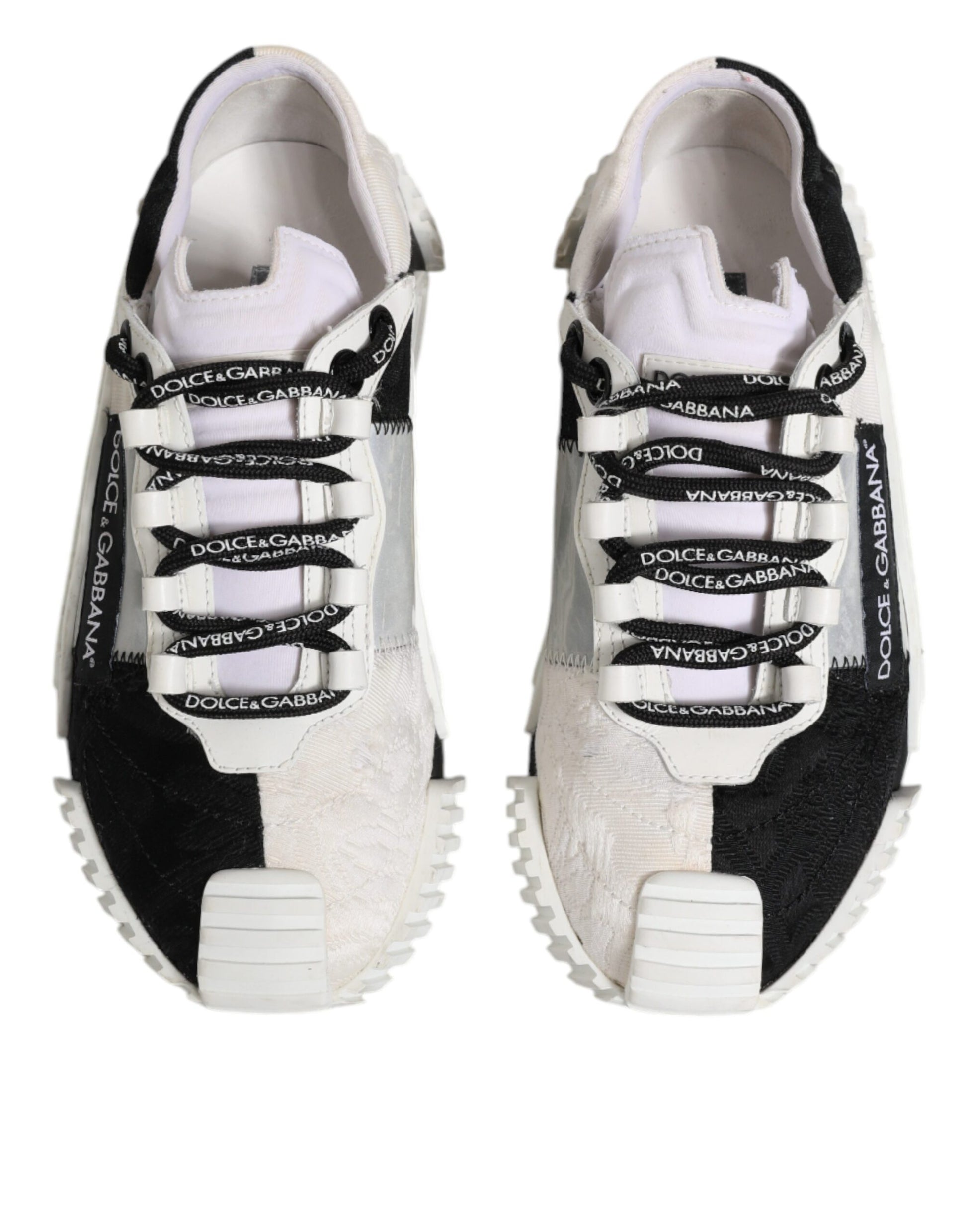 Pair of black and white sneakers with laces