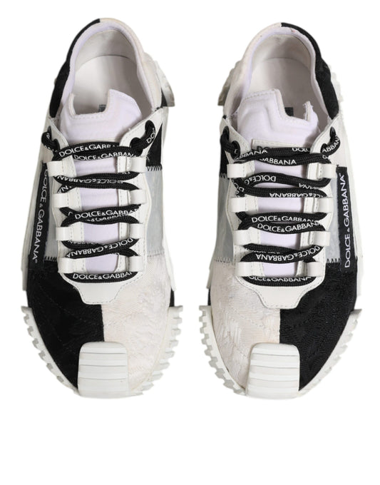 Pair of black and white sneakers with laces