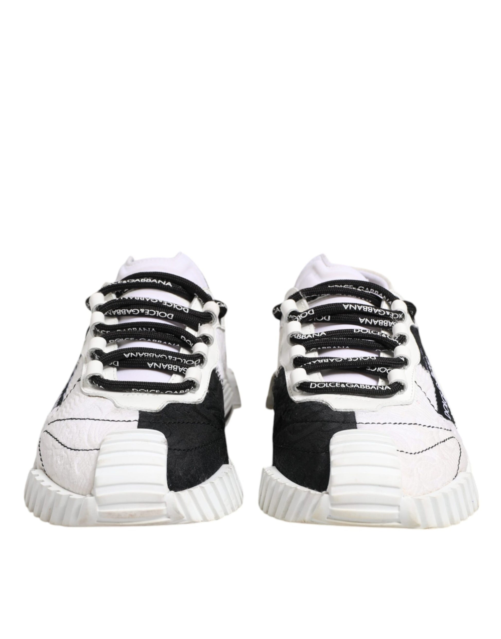 Pair of black and white sneakers with laces