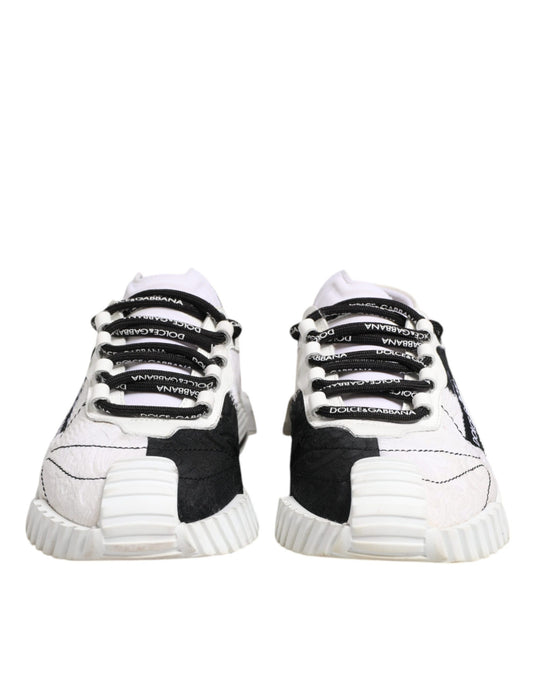 Pair of black and white sneakers with laces