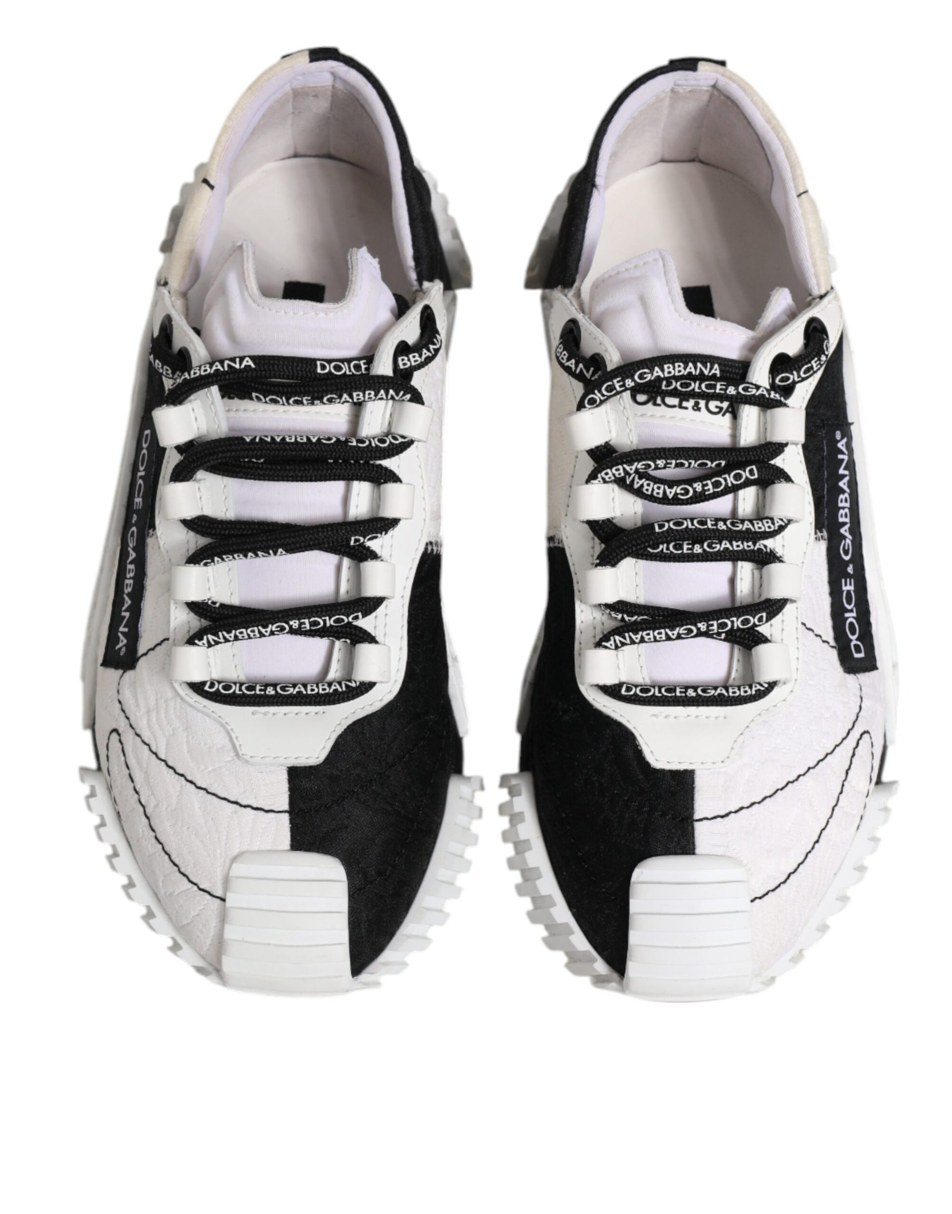 Pair of black and white sneakers with laces