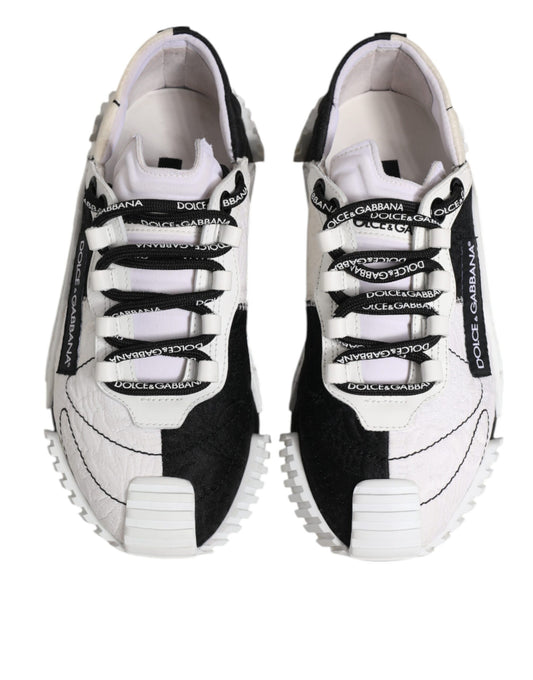 Pair of black and white sneakers with laces