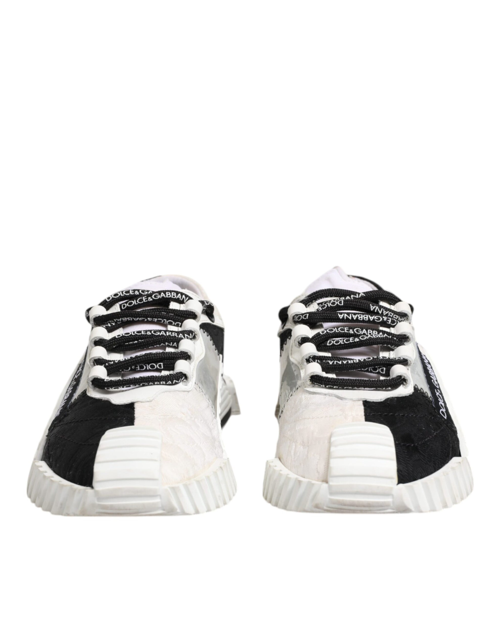 Pair of black and white sneakers with laces