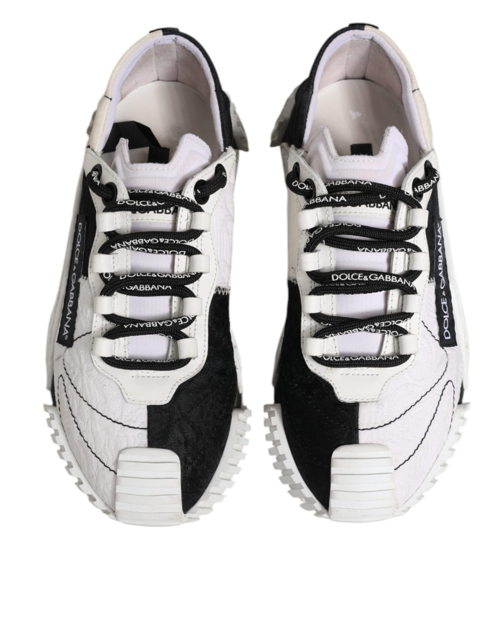 Pair of black and white sneakers with laces