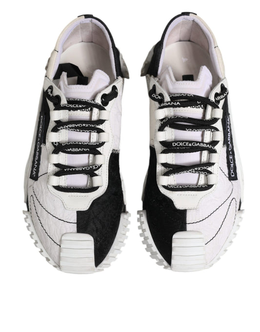 Pair of black and white sneakers with laces