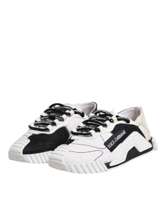 Pair of black and white sneakers with laces