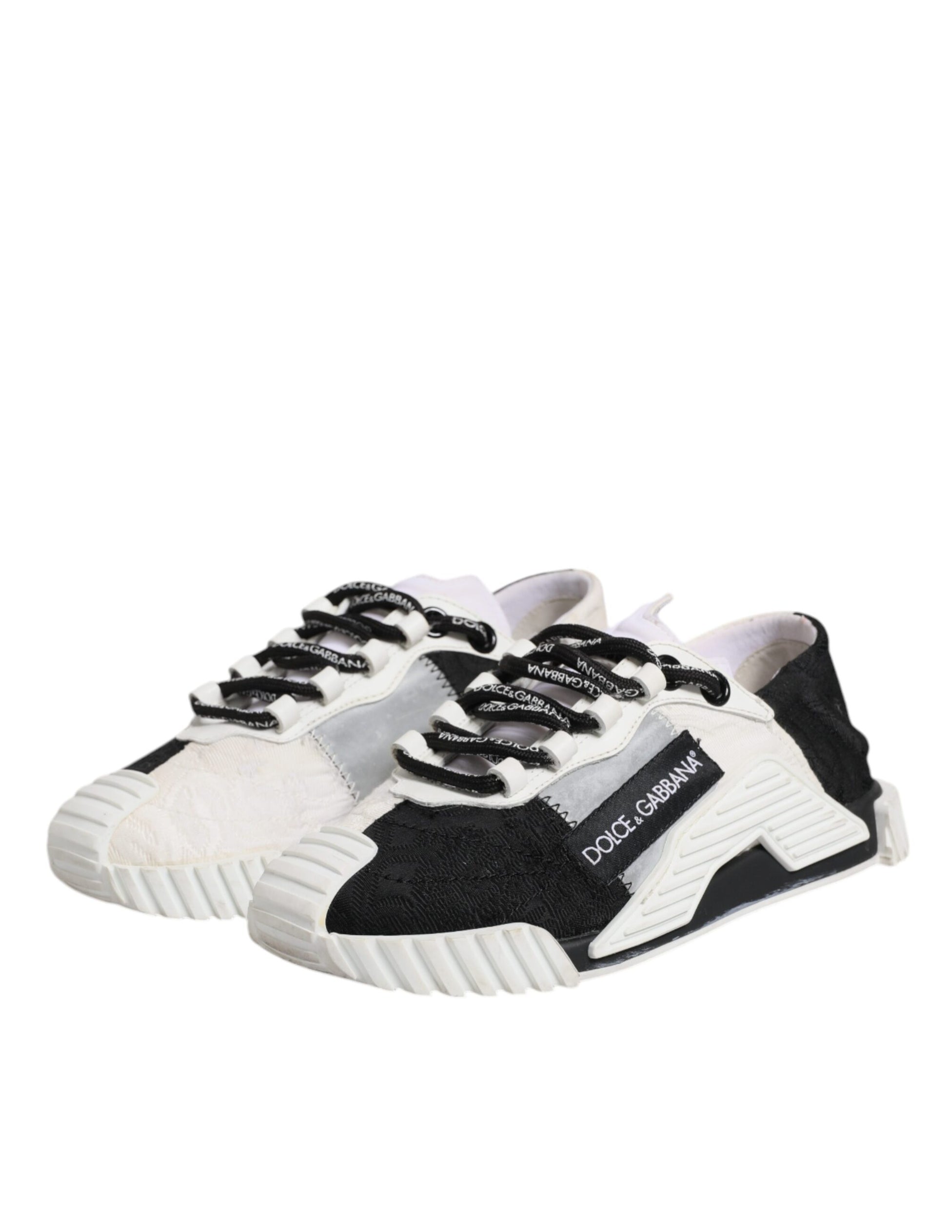 Pair of sneakers with black laces and a white sole