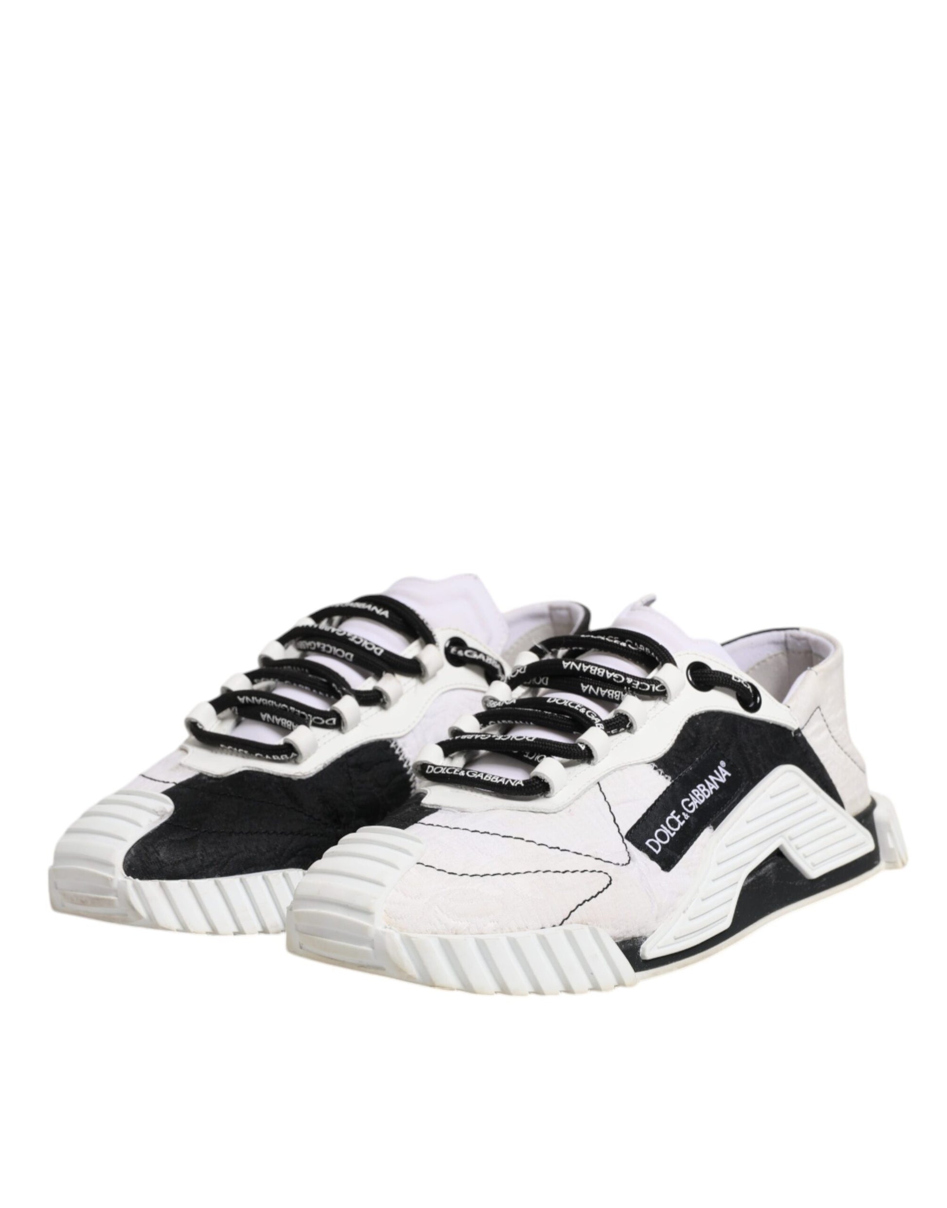 Pair of black and white sneakers with laces