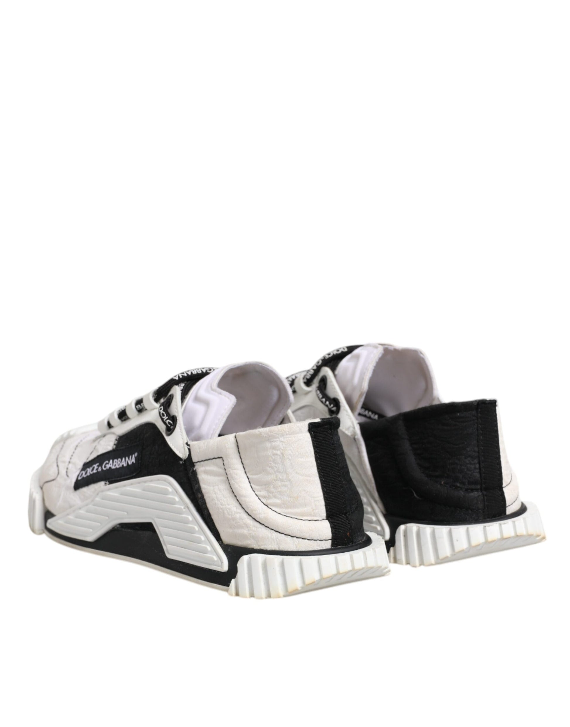 Pair of black and white sneakers with laces