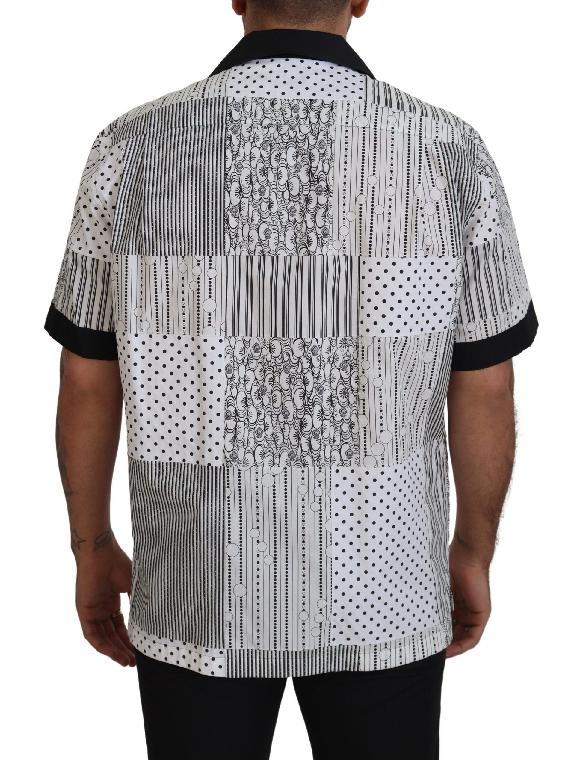 Man wearing a black and white shirt with geometric pattern on back
