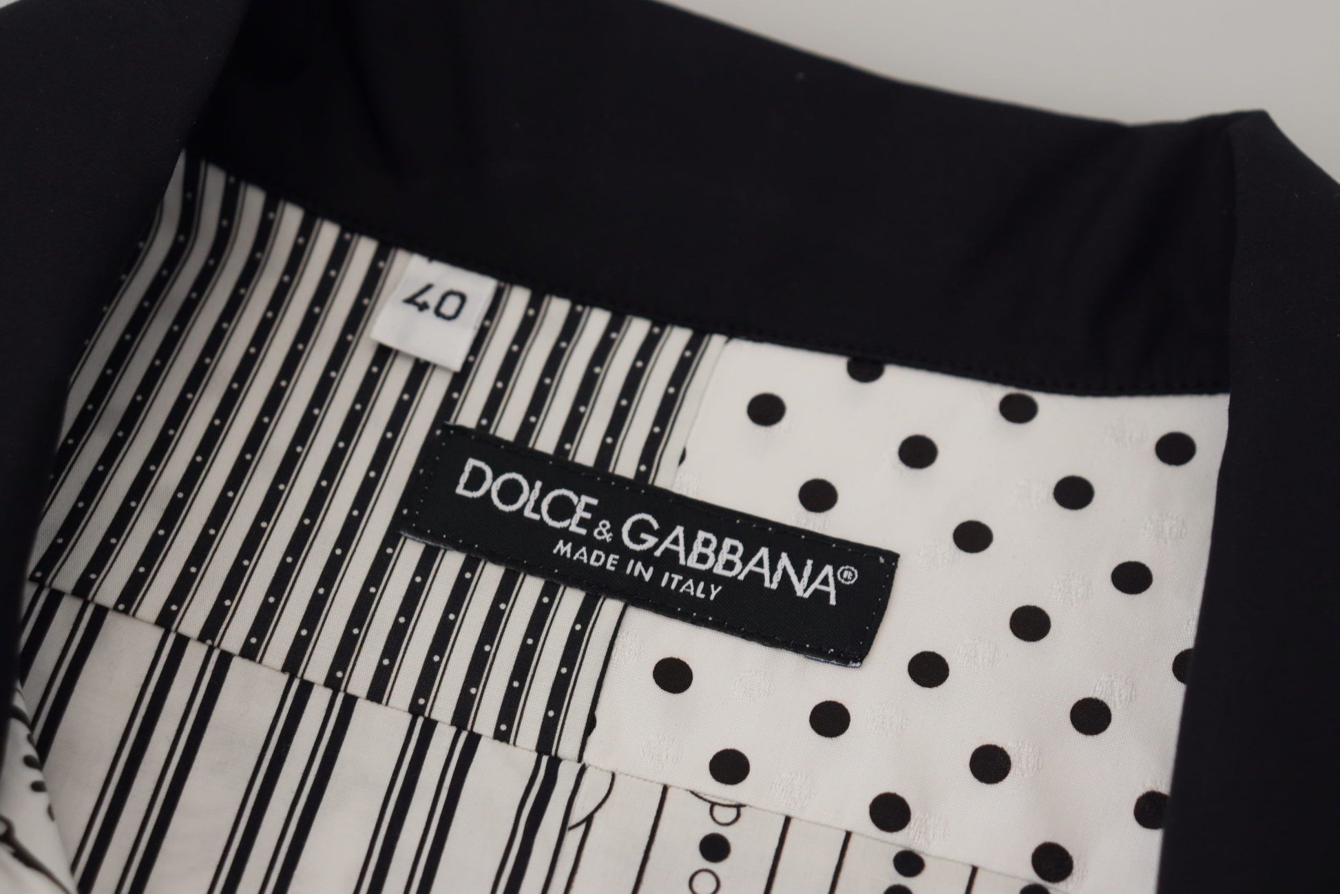 Black and white polka dot towel with brand label