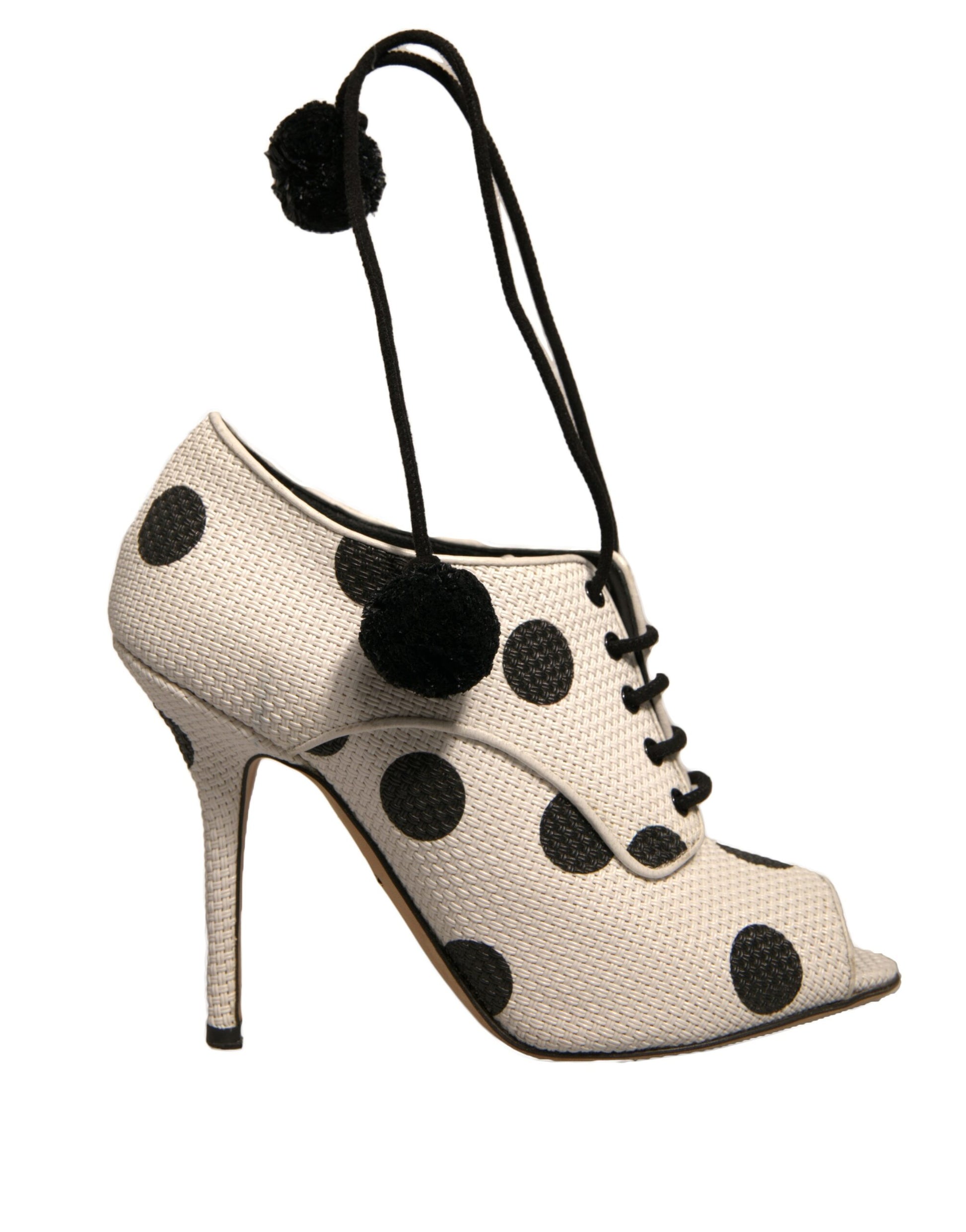 White high heel shoes with black polka dots and tassels