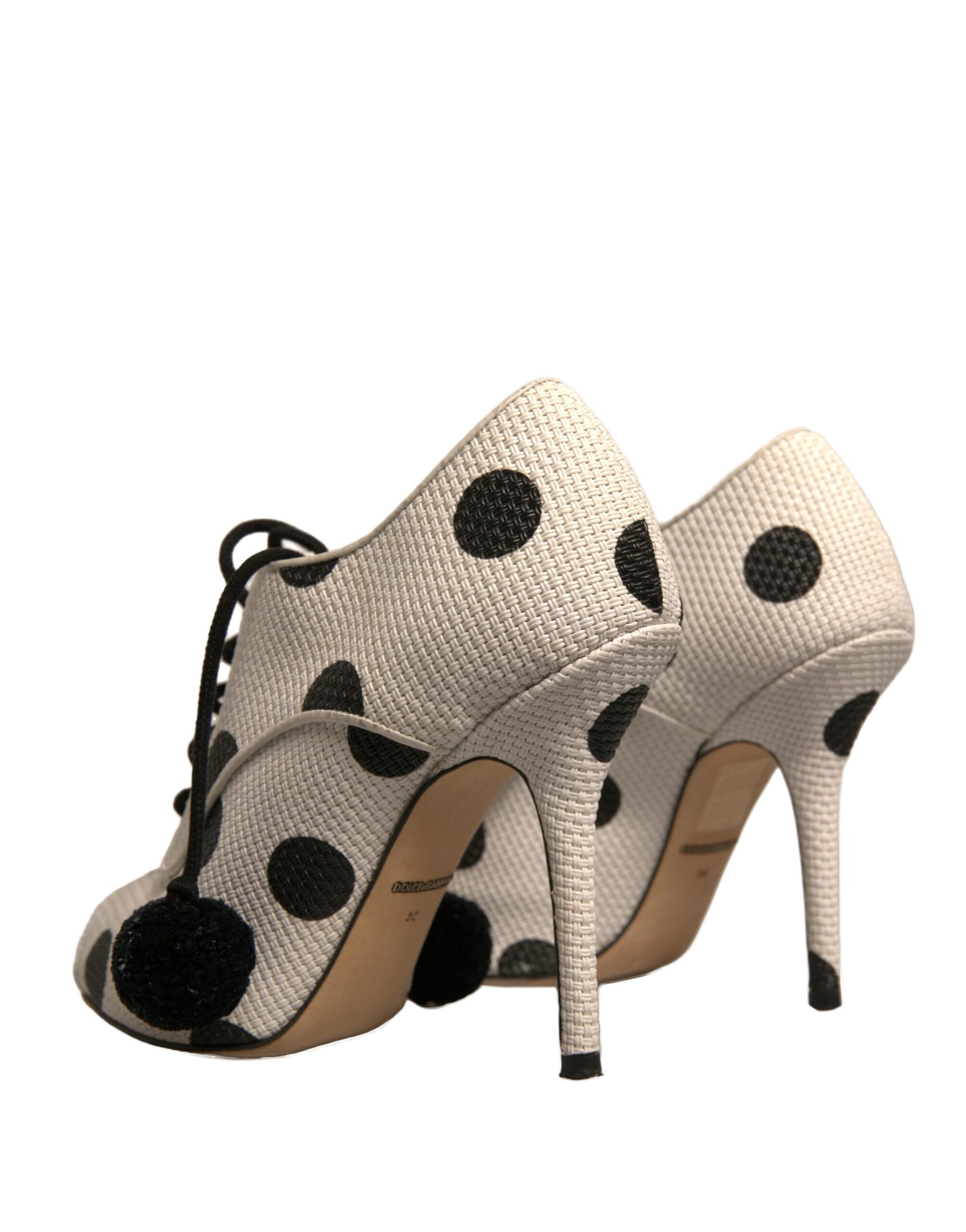 Pair of women's high heel shoes with polka dots