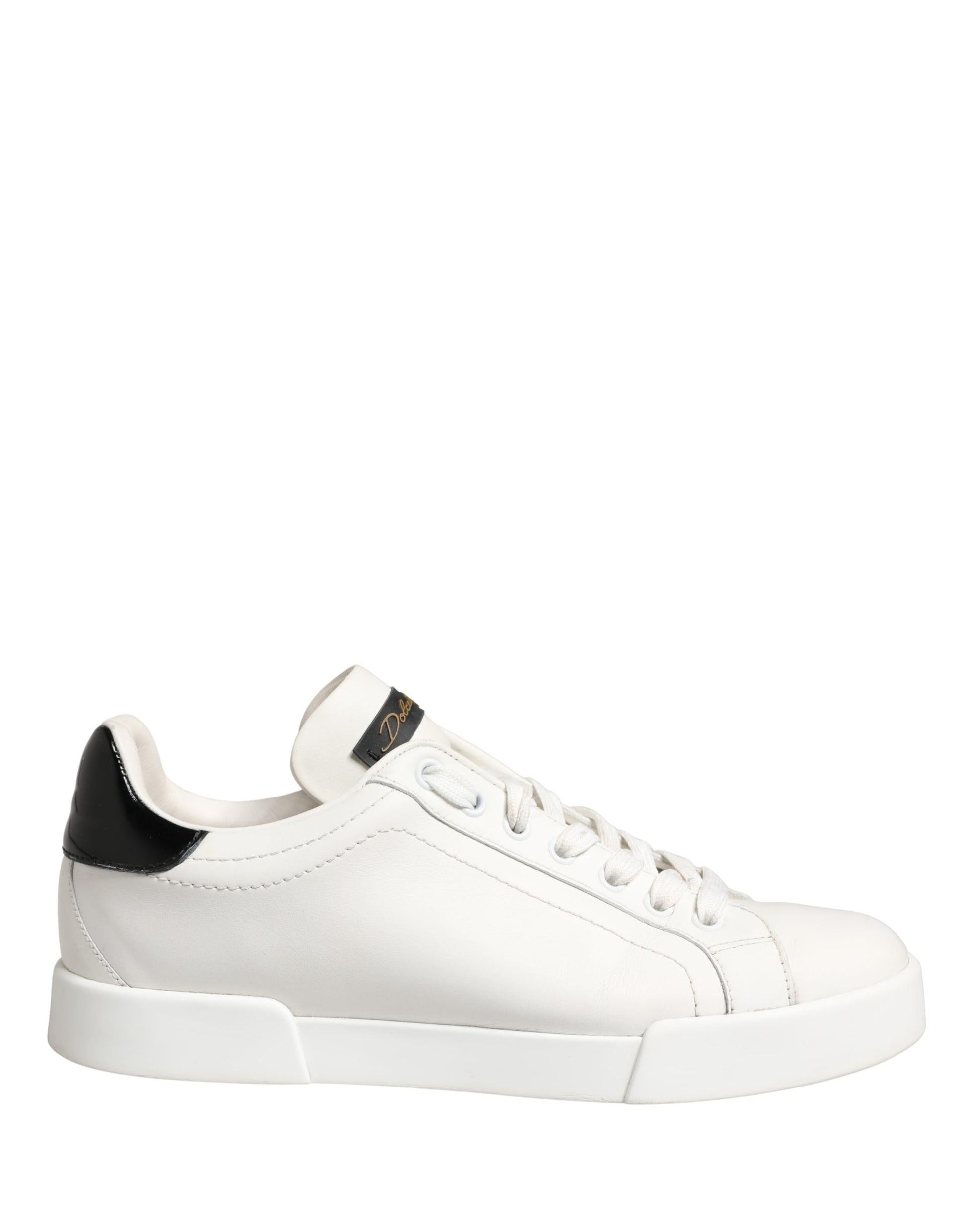 White leather sneakers with black accents, featuring a low-top design and laces