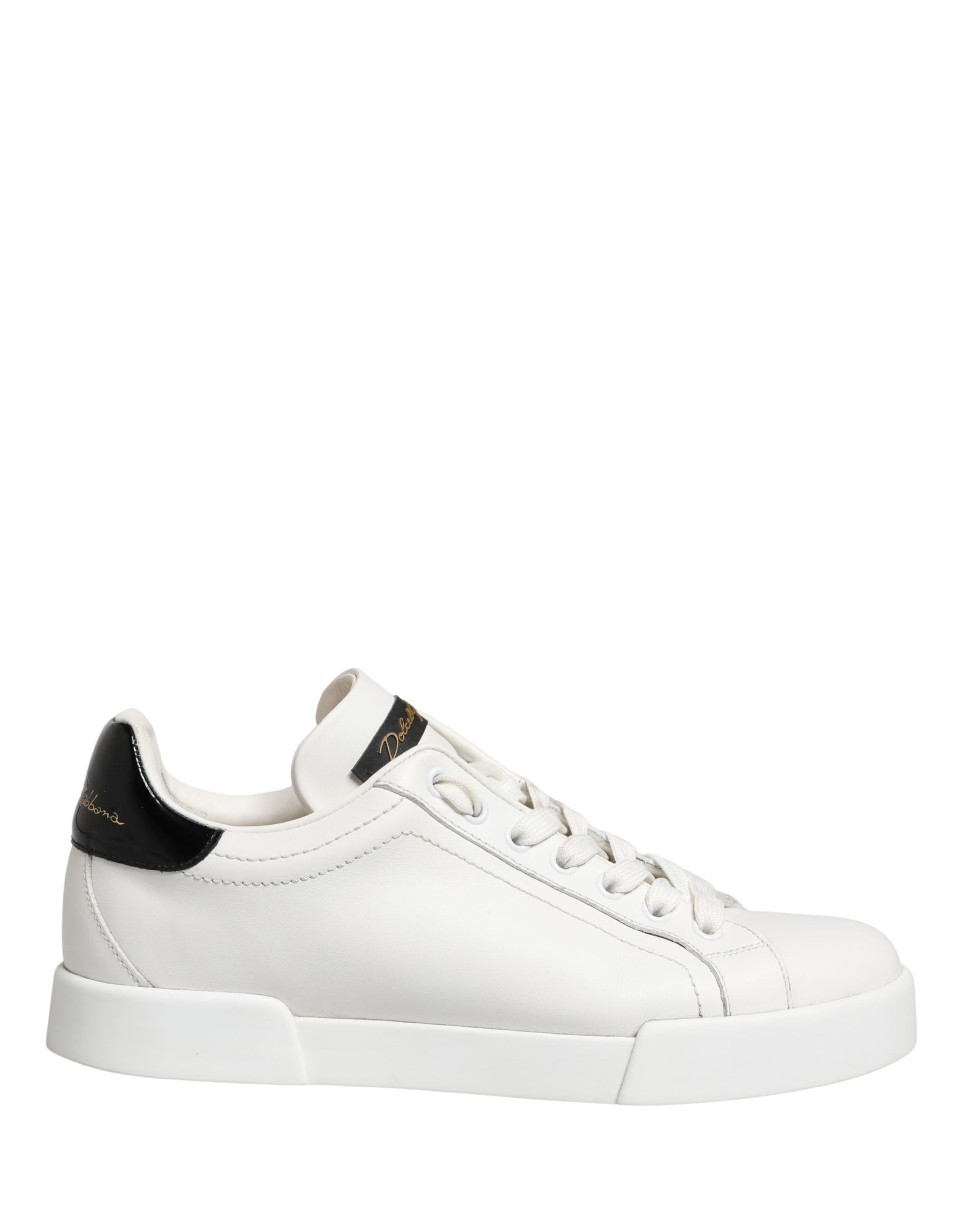 White black leather sneakers with gold accents, featuring a low-top design and lace closure