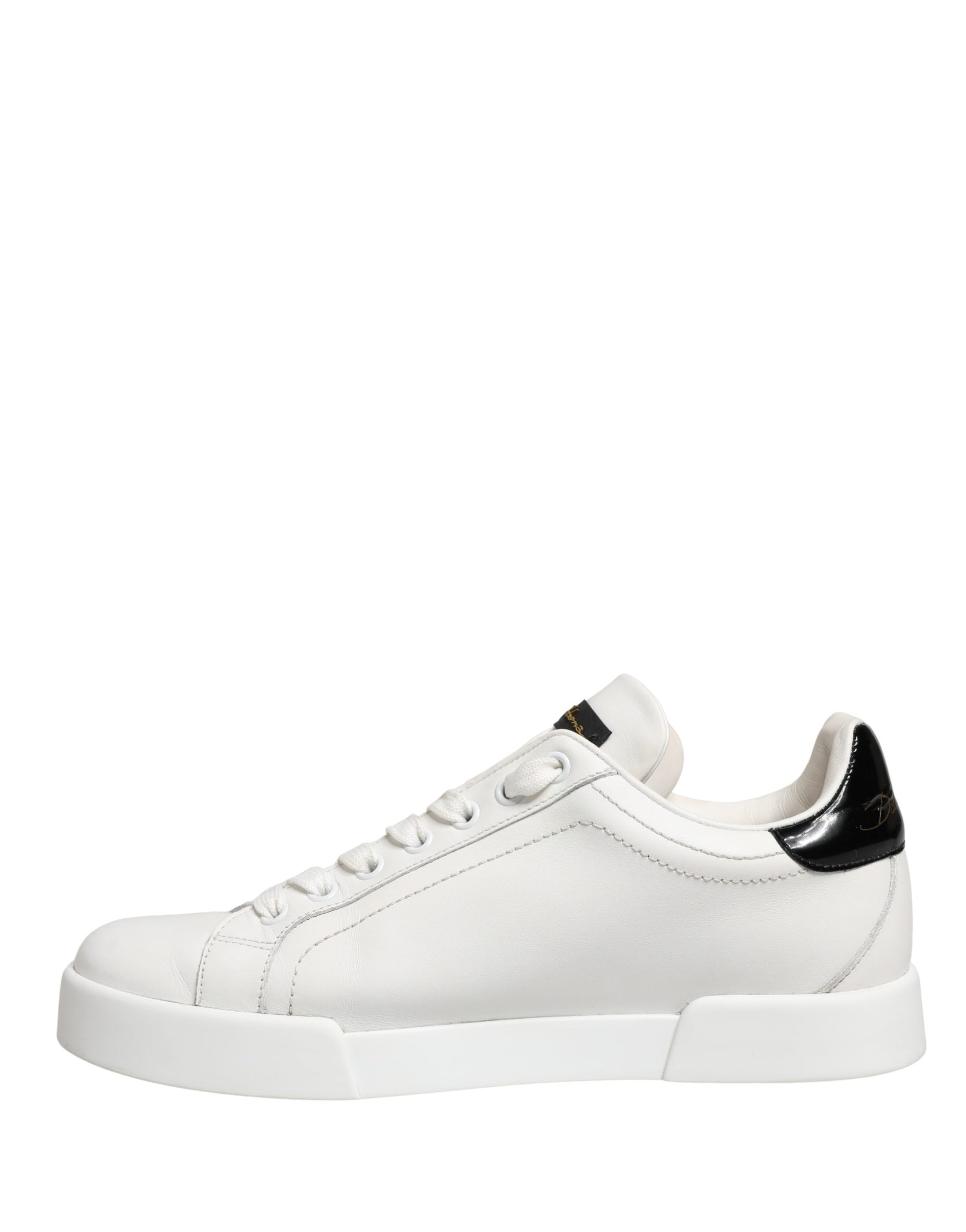 White leather sneakers with black accents, featuring a low top design and chunky sole