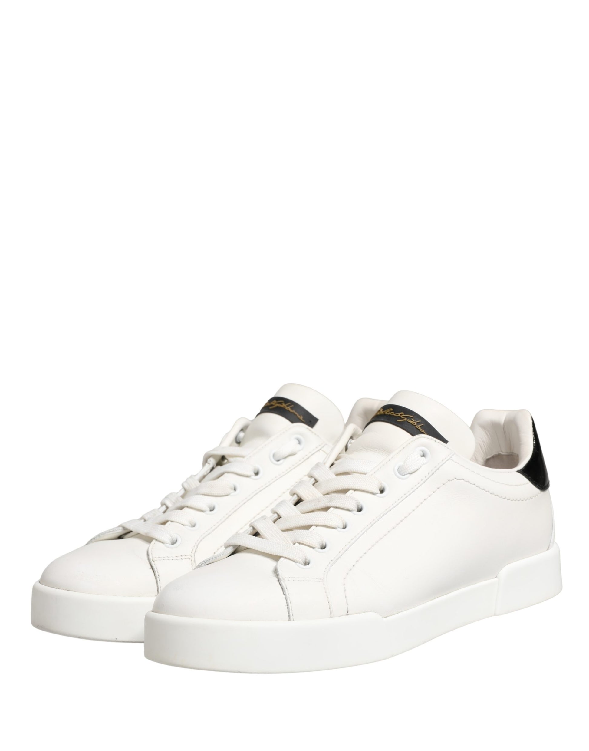 White leather sneakers with black accents, featuring a low-top design and lace closure