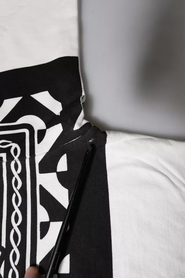 Black and white patterned fabric with a black pen resting on top