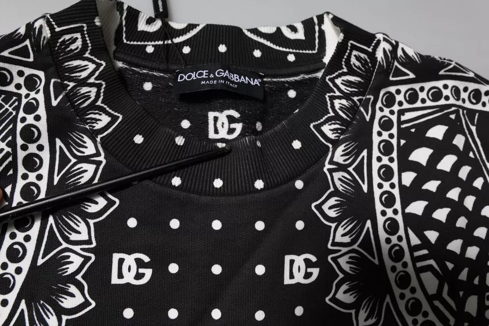 Black sweater with white polka dots and a patterned border
