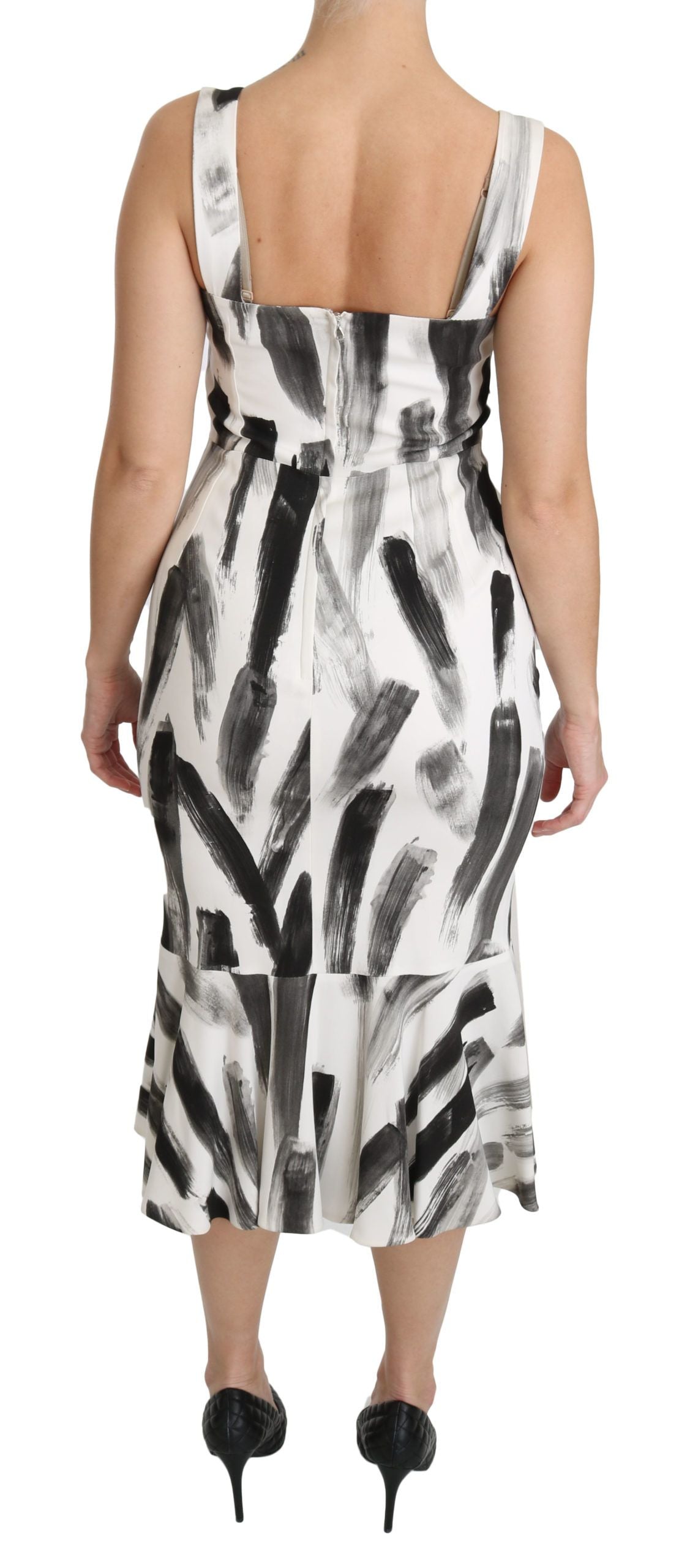 A black and white printed midi dress with a sheath silhouette, made of viscose fabric