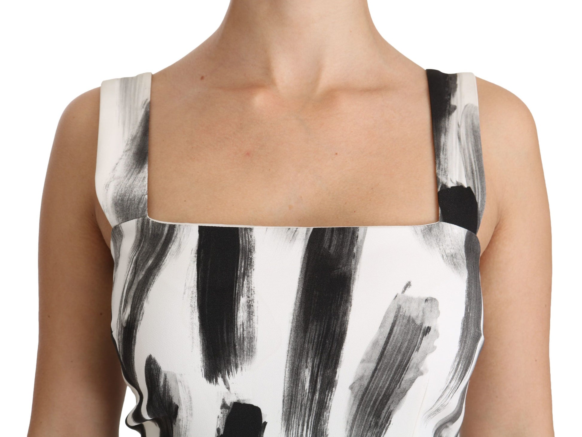 A black and white printed midi dress with a sheath silhouette, made of viscose fabric