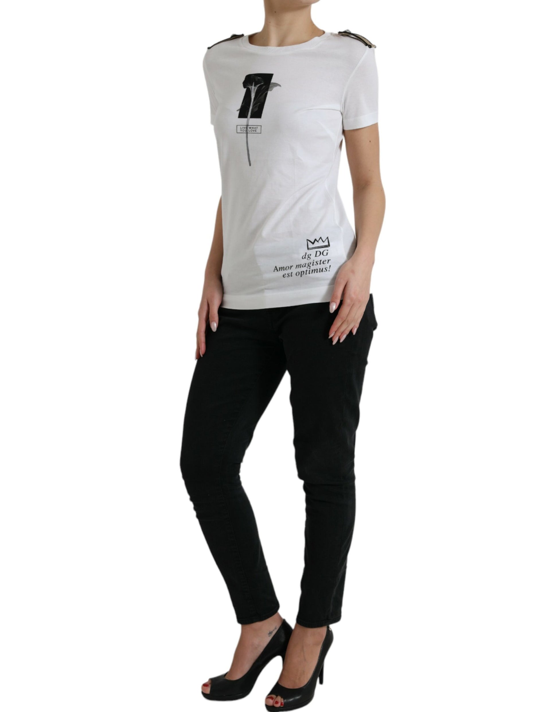 Woman wearing white t-shirt with black design and black pants
