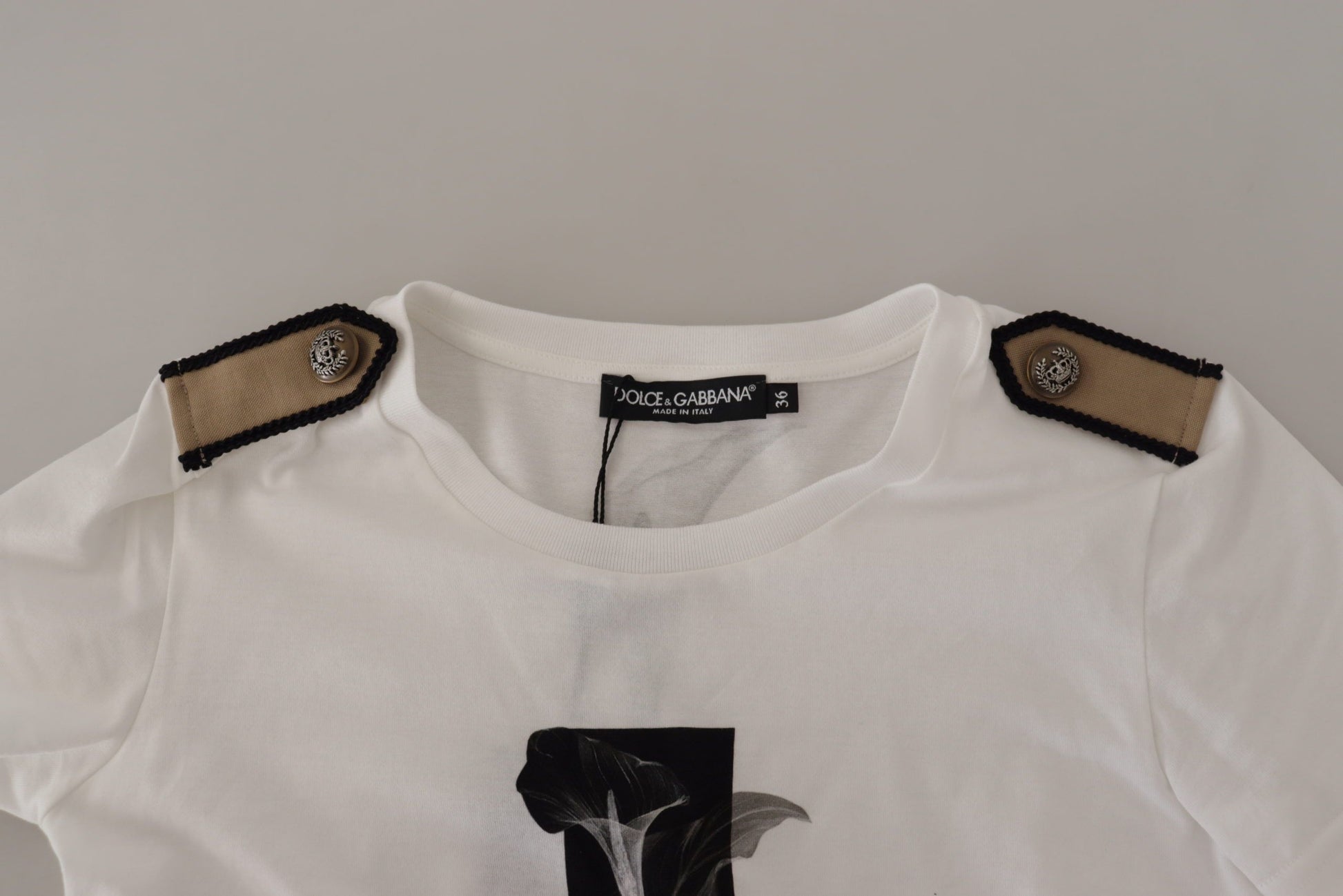 White shirt with embroidered emblem on front