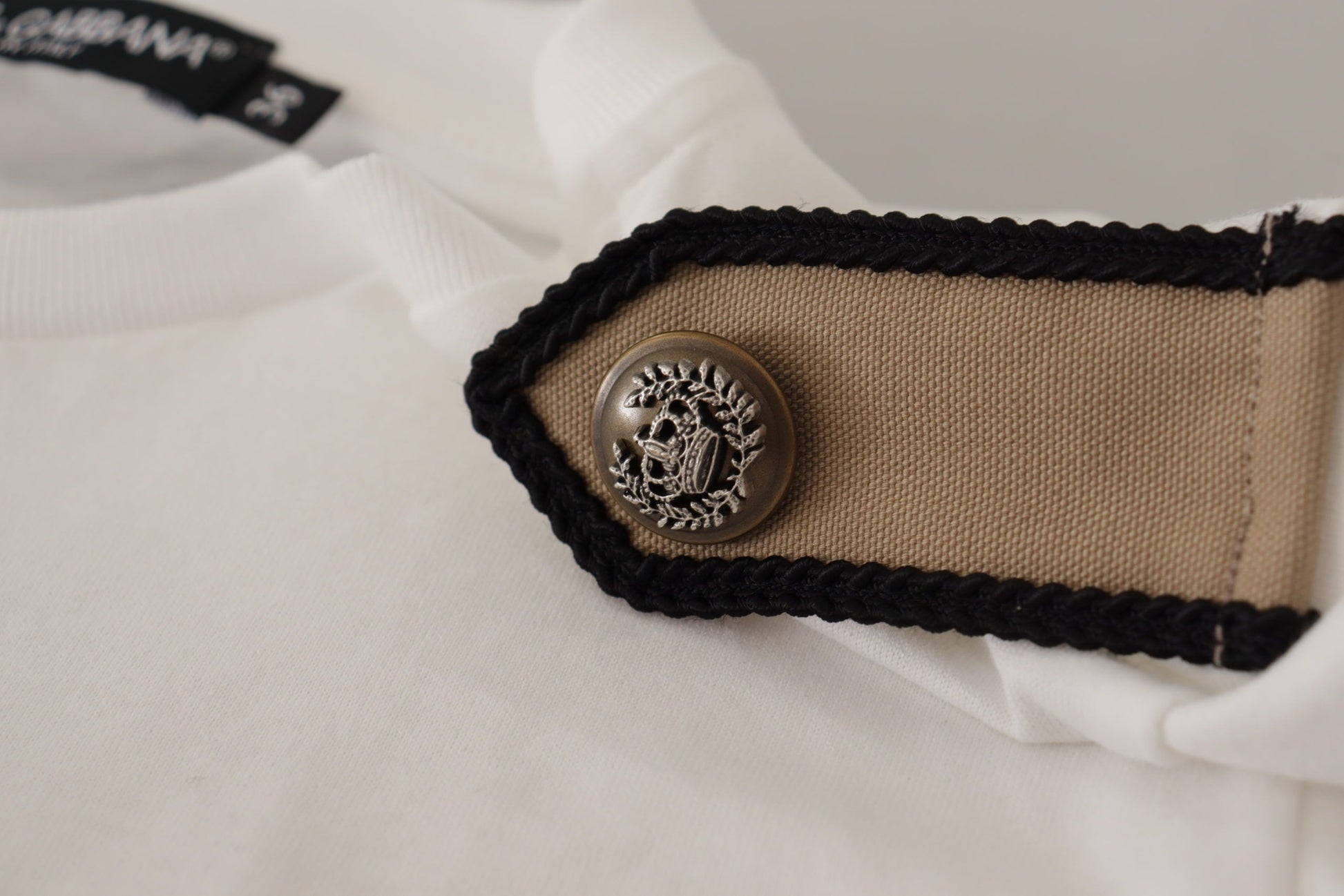 Tan fabric patch on white shirt