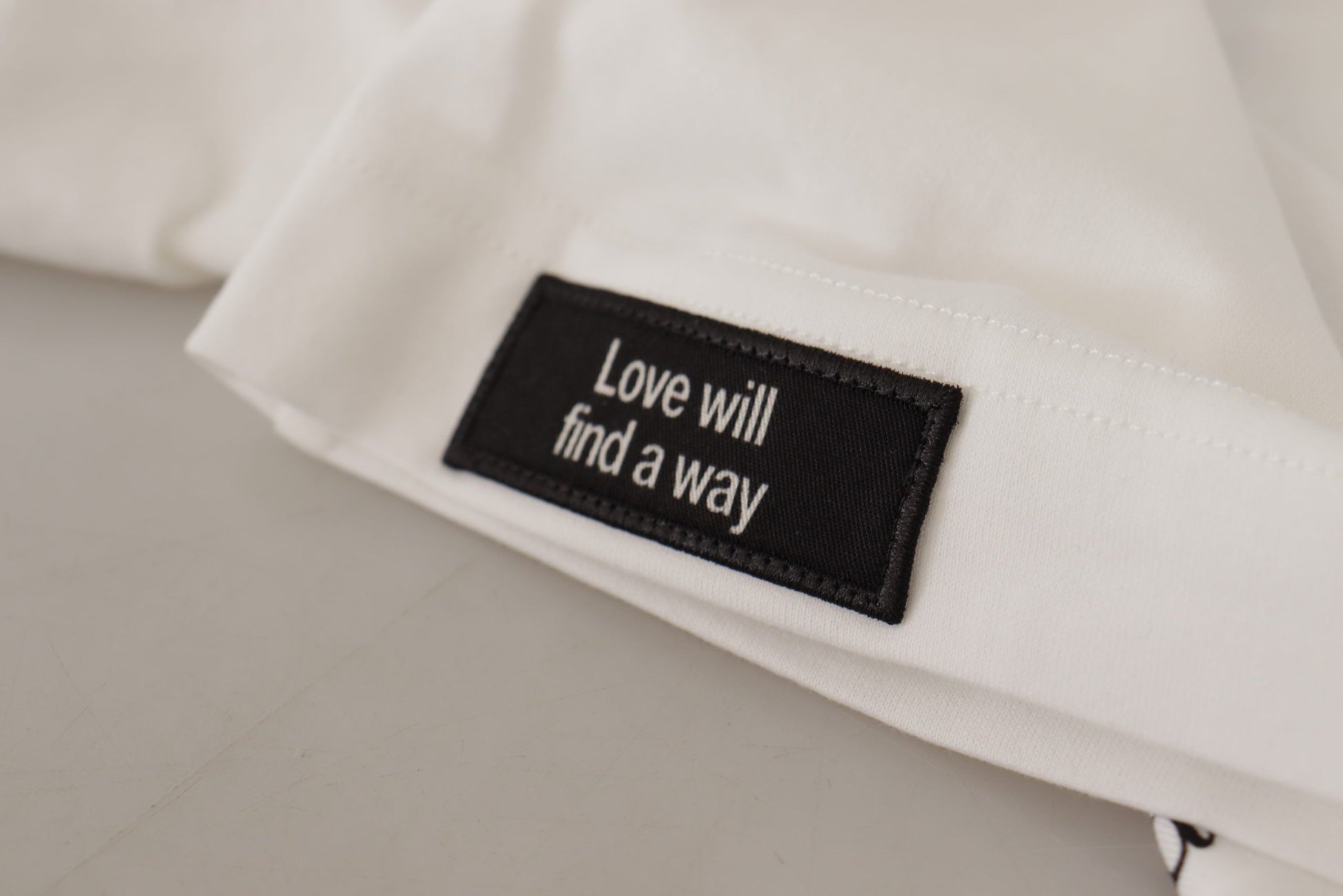 White t-shirt with black lettering on tag
