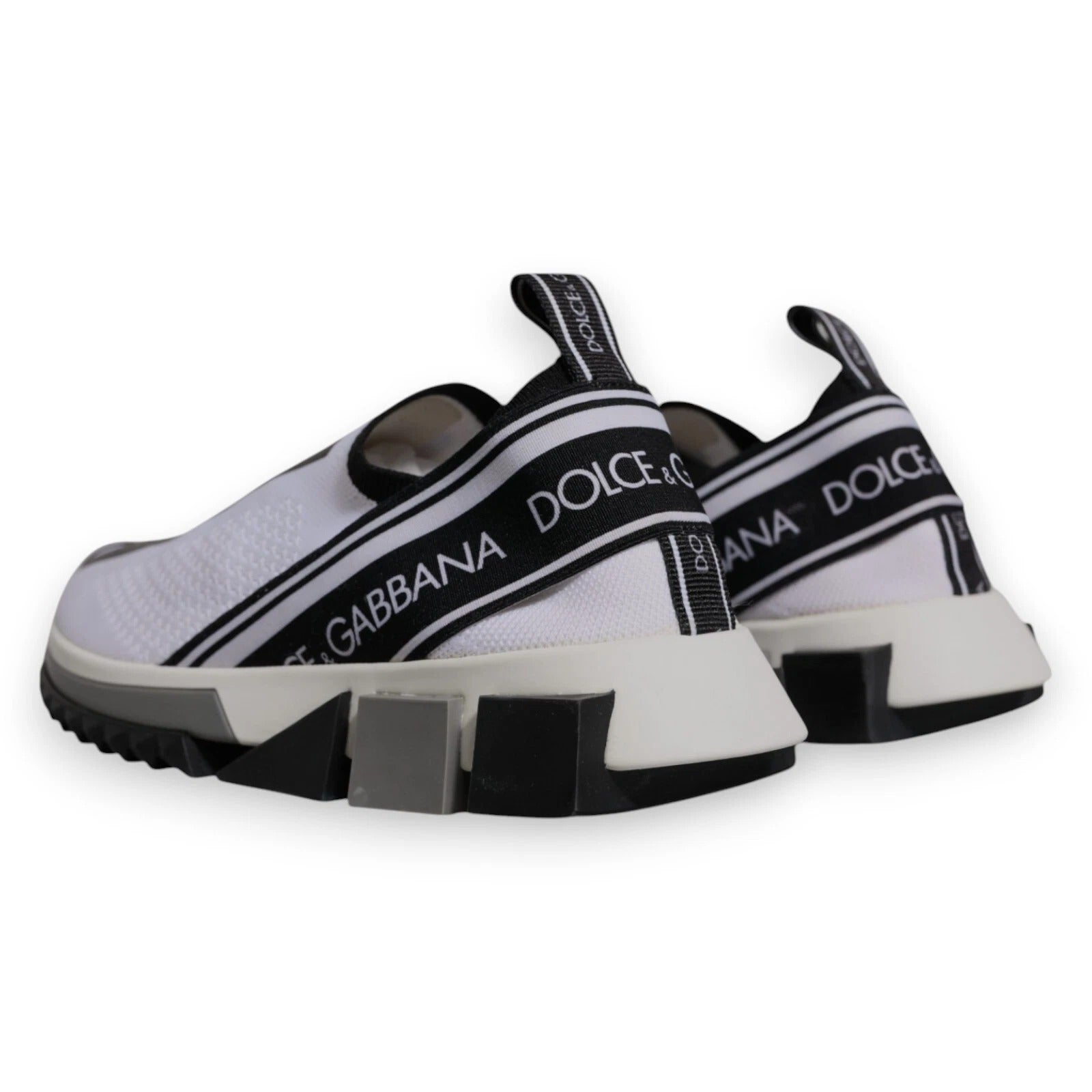 White sneakers with black stripes and brand name on side
