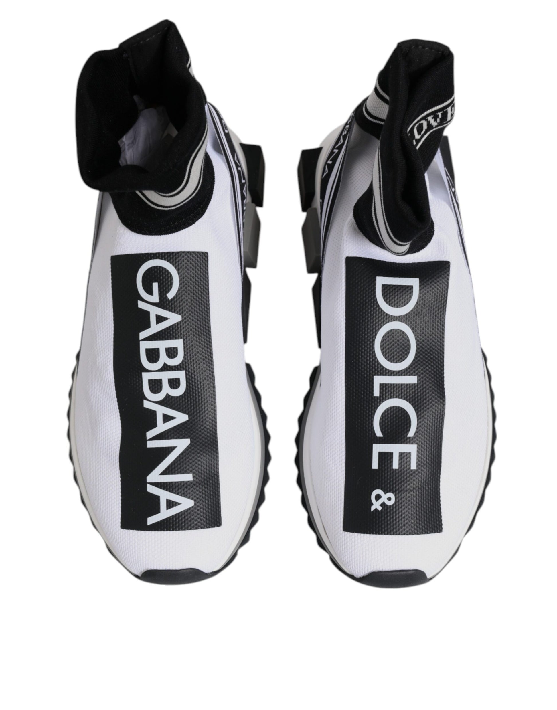 Pair of white sneakers with black laces and brand logos on side