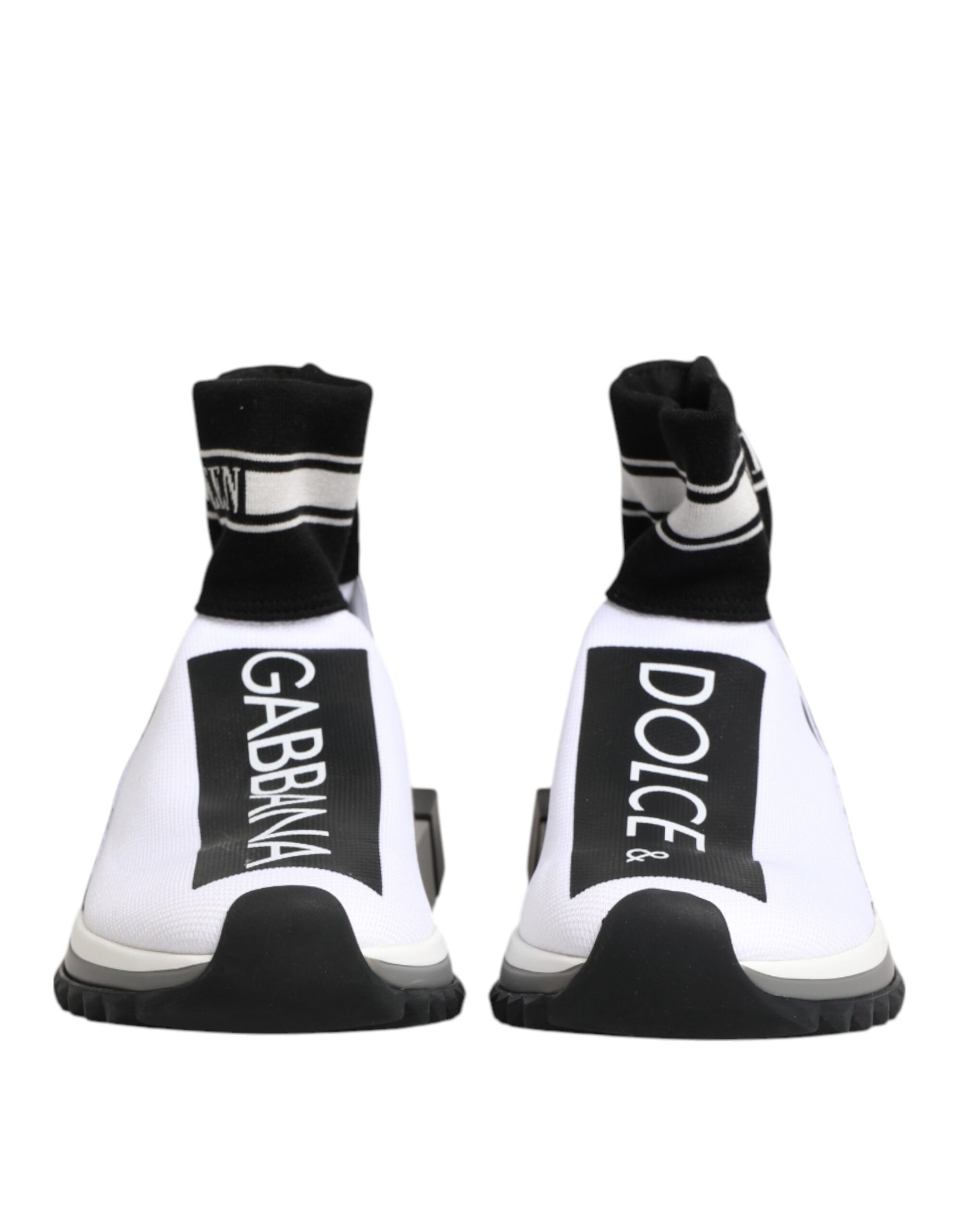 Pair of white sneakers with black laces and soles