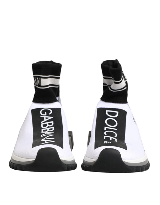 Pair of white sneakers with black laces and soles