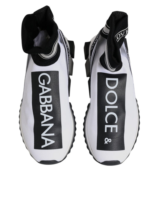 Pair of white sneakers with black laces and brand logos on side