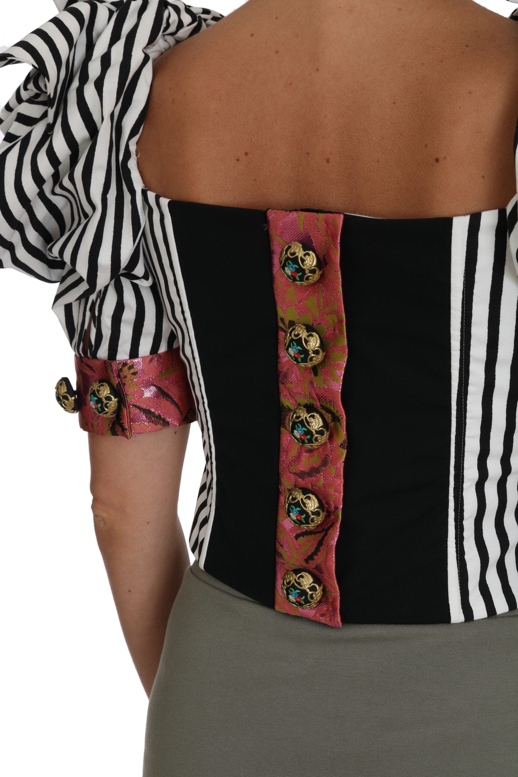 Black and white corset with red embellishments