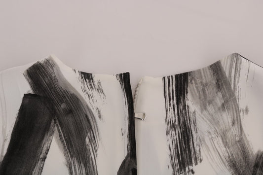Abstract art piece with black and white brush strokes on canvas