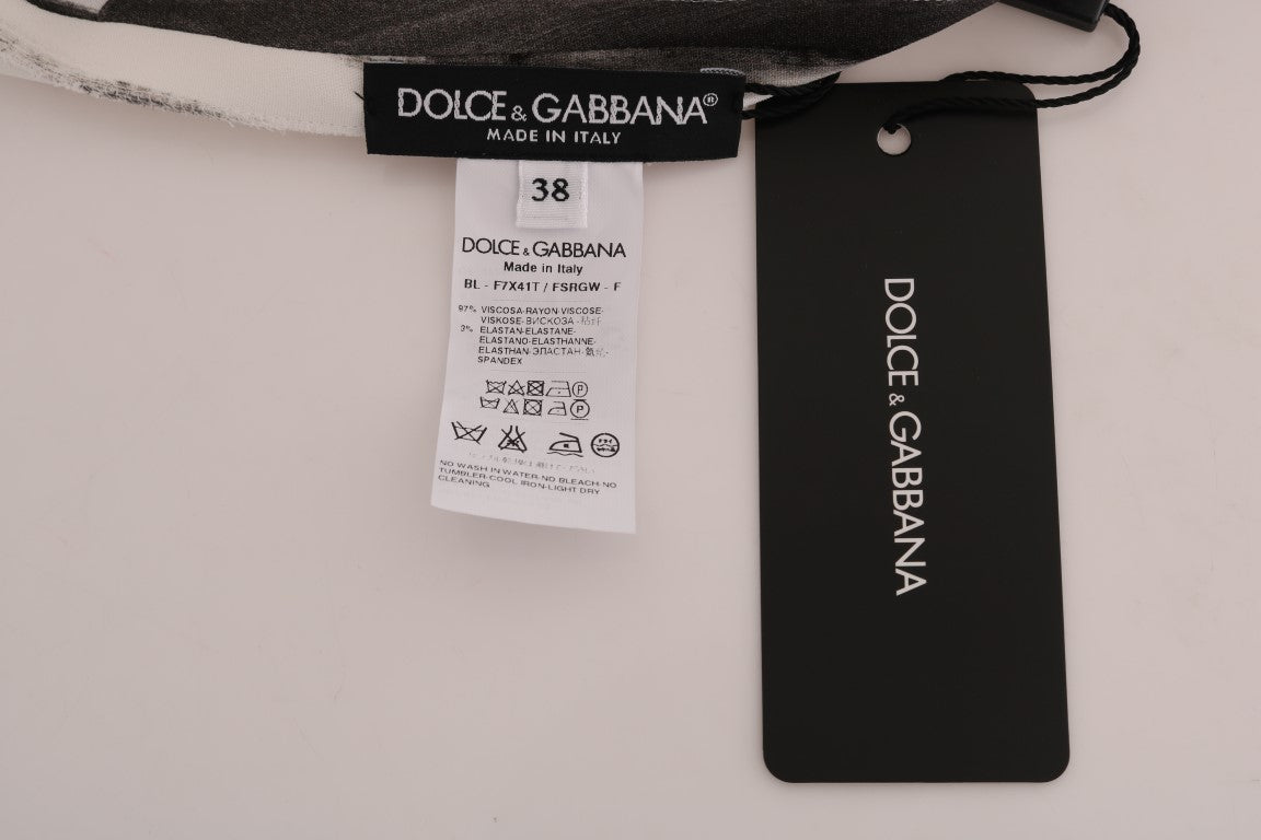 Tag on a black background with white text reading "DOLCE & GABBANA"