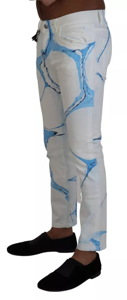 Pair of blue jeans with white design on legs