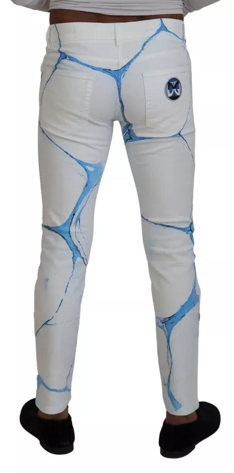 White jeans with blue cracked design on legs
